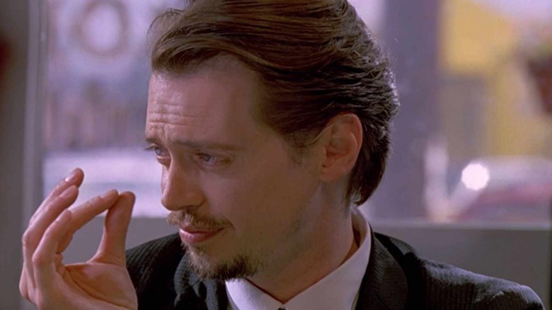 Steve Buscemi playing a small violin