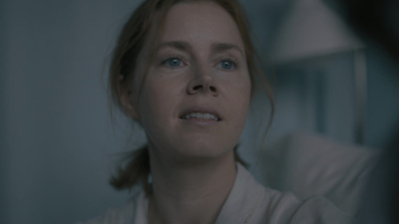 Amy Adams flares nostrils looks up to side