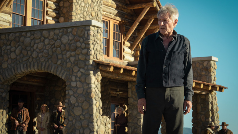 Jacob Dutton standing in front of his home