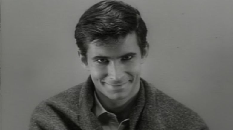 Norman Bates smirking creepily black and white