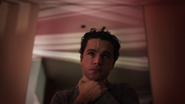 Christopher Abbott looks in mirror