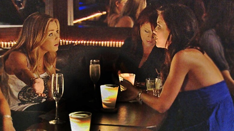 Lauren Conrad and Audrina Patridge drinking in a bar