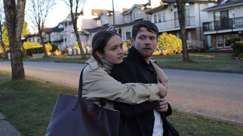 Olivia Cooke holding Jack O'Connell