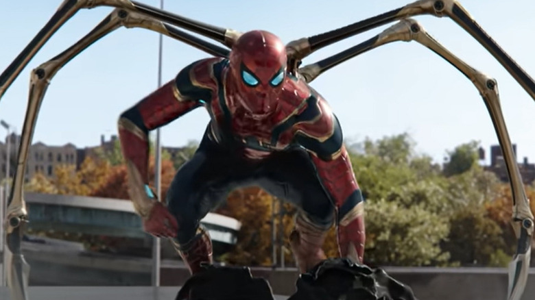 Iron Spider-Man crouching on car