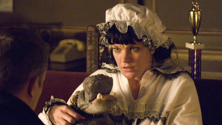 Abby, in her pajamas, holds a stuffed hippo on "NCIS: Season 4"