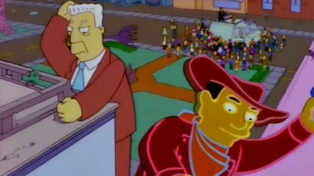 Giant Kent Brockman breaks building