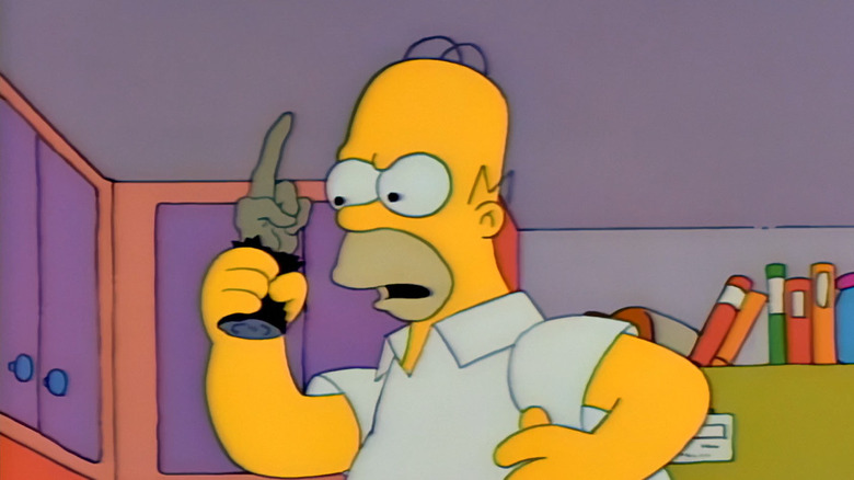 Homer holds the monkey's paw