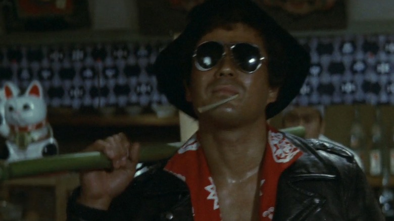 Sonny Chiba in sunglasses as Katsutoshi Otomo