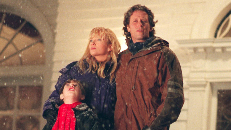 Jack Torrance squinting in the snow with his family by his side