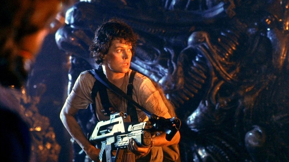 Sigourney Weaver holding a flamethrower