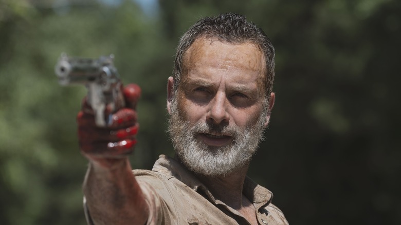 Rick Grimes pointing gun on The Walking Dead