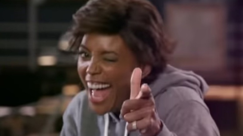 Aisha Tyler winking and pointing finger