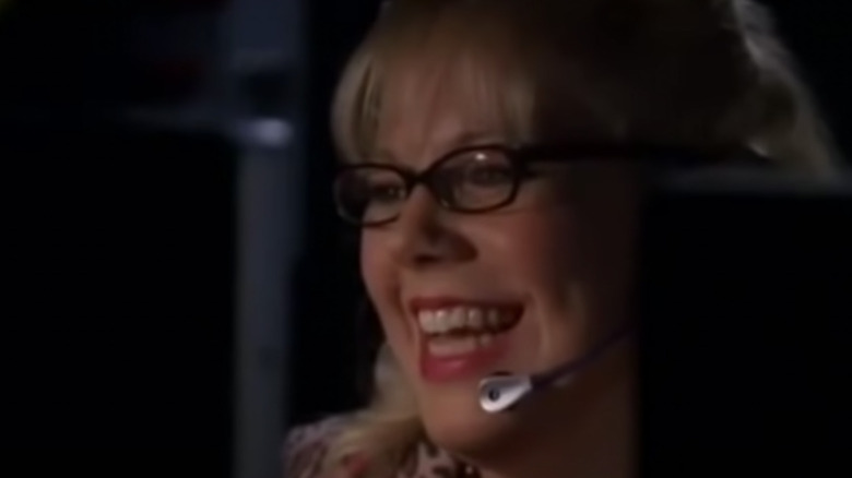 Penelope Garcia with a wide smile.