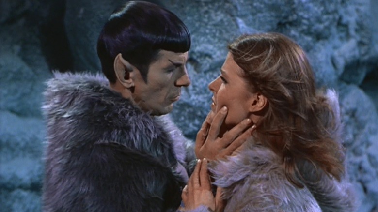 Spock holds a woman