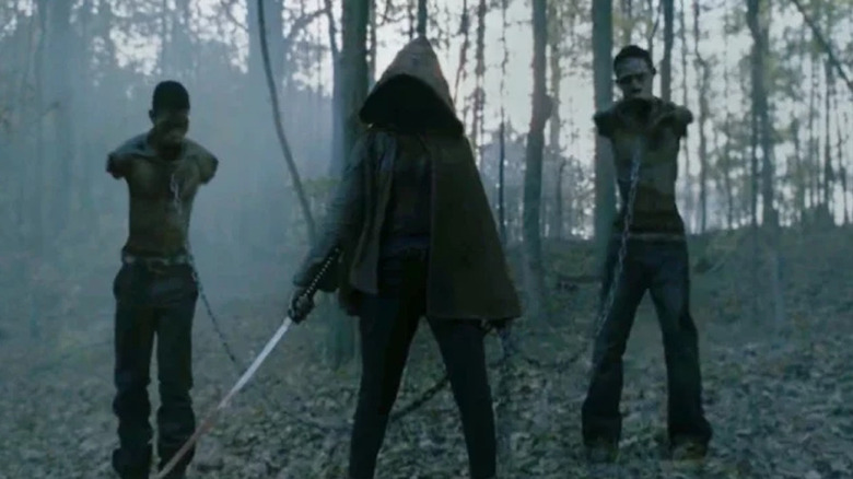 Michonne in the woods with walkers