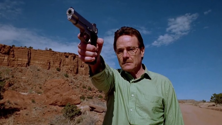 Walter White holds a gun