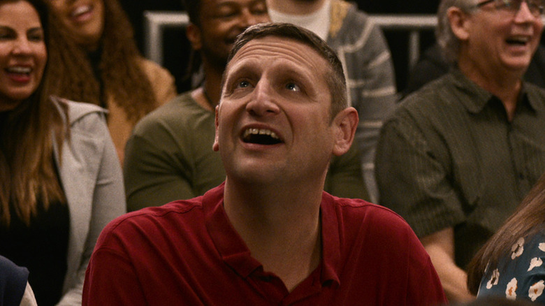 Tim Robinson smiling in crowd