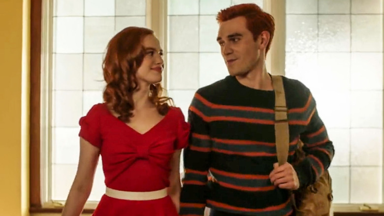 Archie and Betty stand togehter