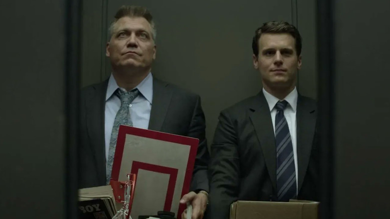 Jonathan Gross and Holt McCallany in elevator