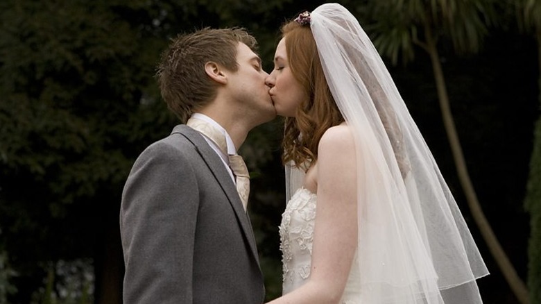 Amy and Rory kiss at their wedding