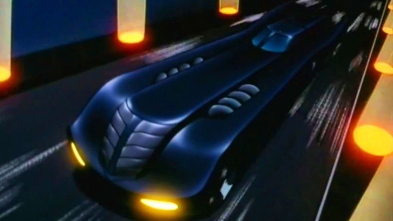 The animated Batmobile speeds through Gotham City