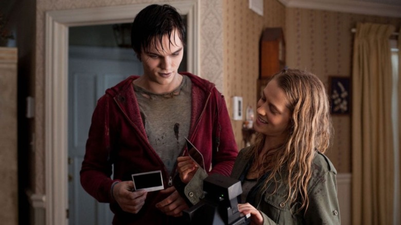 Nicholas Hoult zombie looking at photos