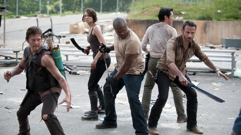 Daryl, Maggie, T-Dog, Glenn, & Rick fighting walkers