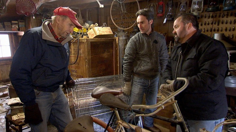 Mike Wolfe and Frank Fritz looking at a set of bikes