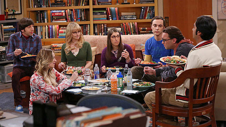 Big Bang Theory cast eating on couch