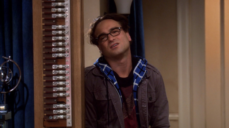 Leonard Hofstadter standing beside a vintage fuse holder