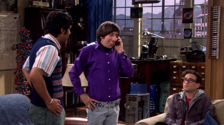 Howard on phone as Raj and Leonard look on