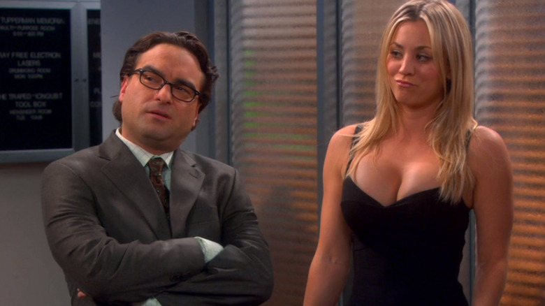 Leonard in suit and Penny in dress