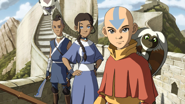 Aang, Katarra, Sokka, Momo, and Appa on the earth kingdom wall