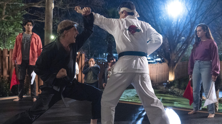 William Zabka as Johnny Lawrence and Ralph Macchio as Daniel LaRusso in Cobra Kai