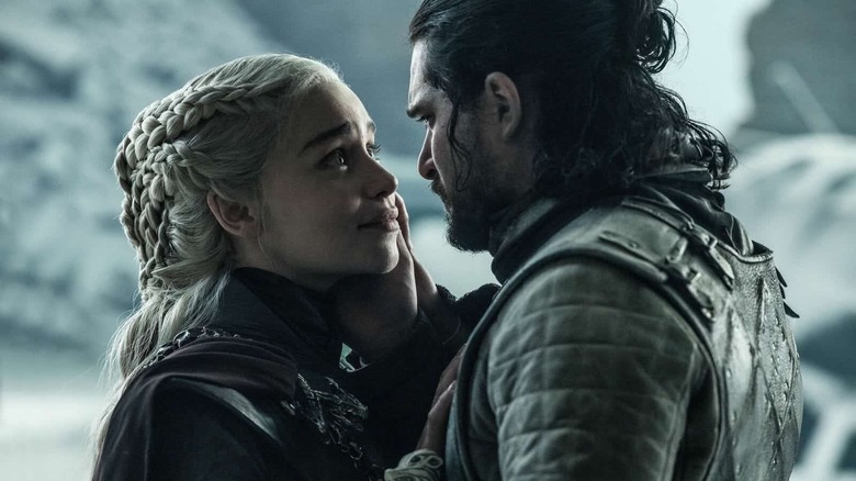 Kit Harrington Emilia Clarke embracing Game of Thrones