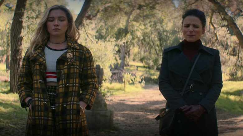 Yelena and Valentina standing at grave