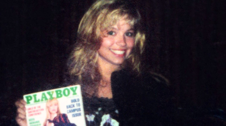 Pamela Anderson holds Playboy magazine