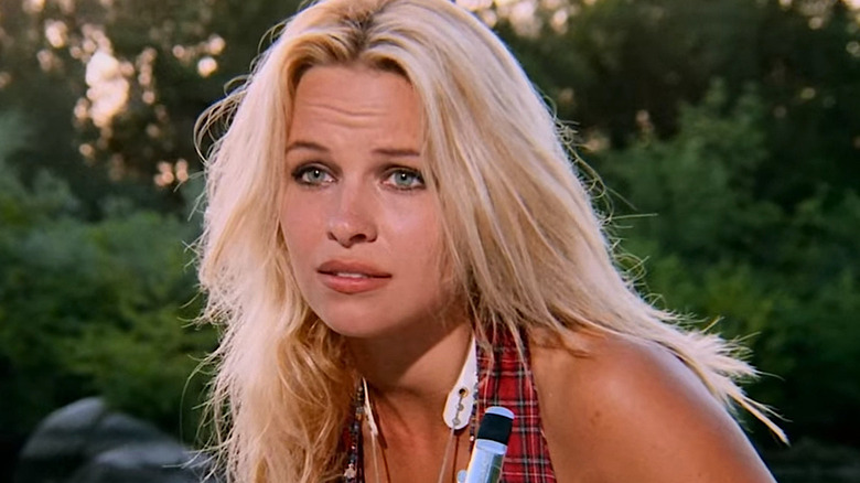 Pamela Anderson cringes in woods