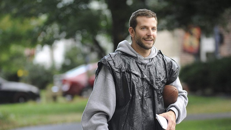 Bradley Cooper holding a football