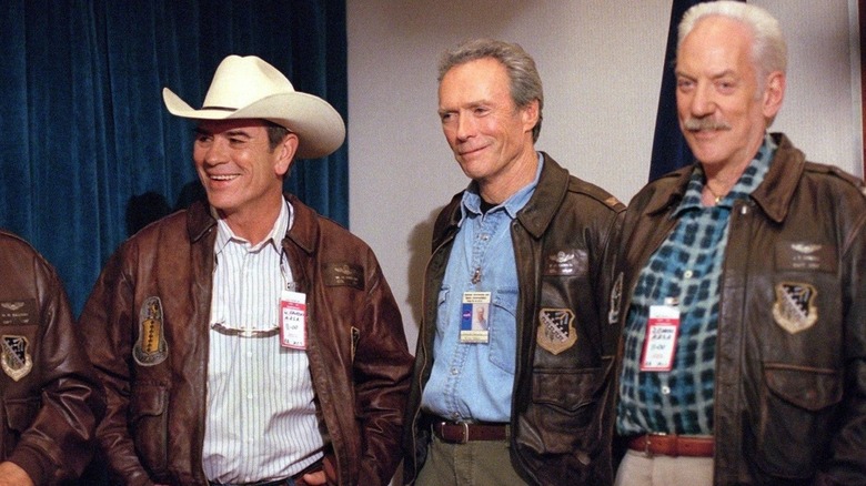 Jones, Eastwood and Sutherland smiling