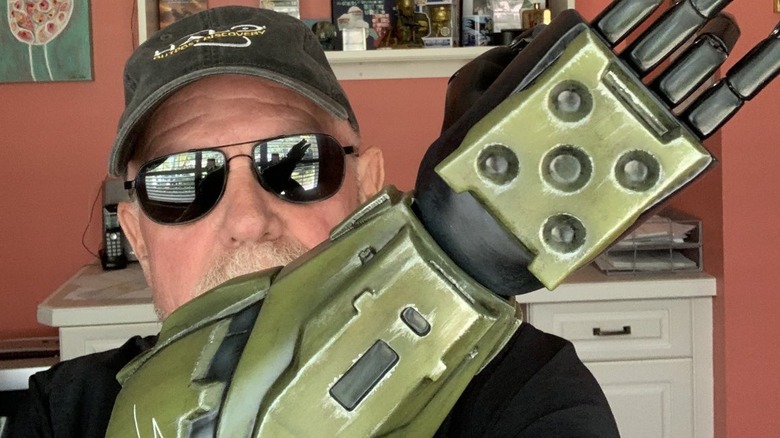 Steve Downes holding master chief prosthetic 