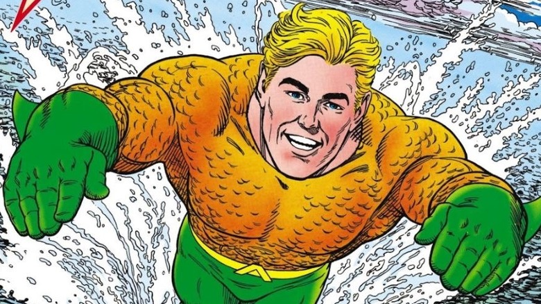 Aquaman swimming and smiling