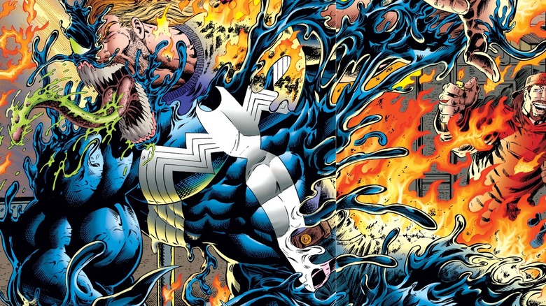 Venom recoiling as he's attacked with fire