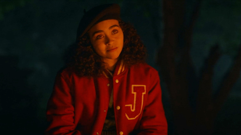 Claudia wearing letterman jacket