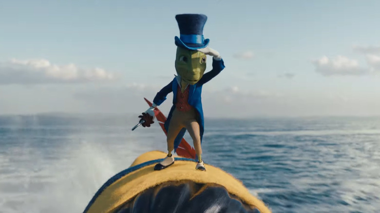 Jiminy Cricket atop Pinocchio's hat in the open ocean