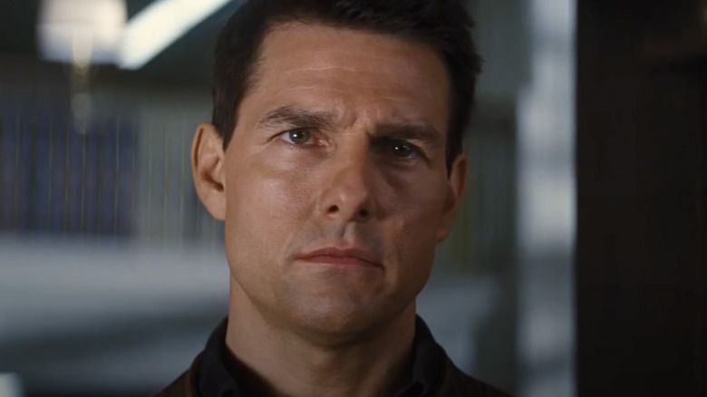 Tom Cruise as Reacher glaring