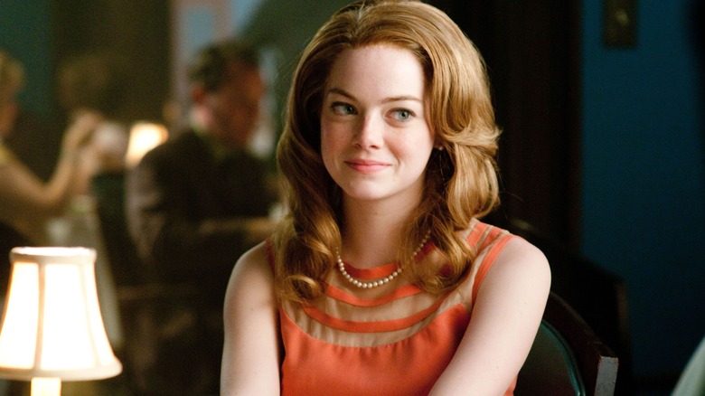 Emma Stone seated in lounge