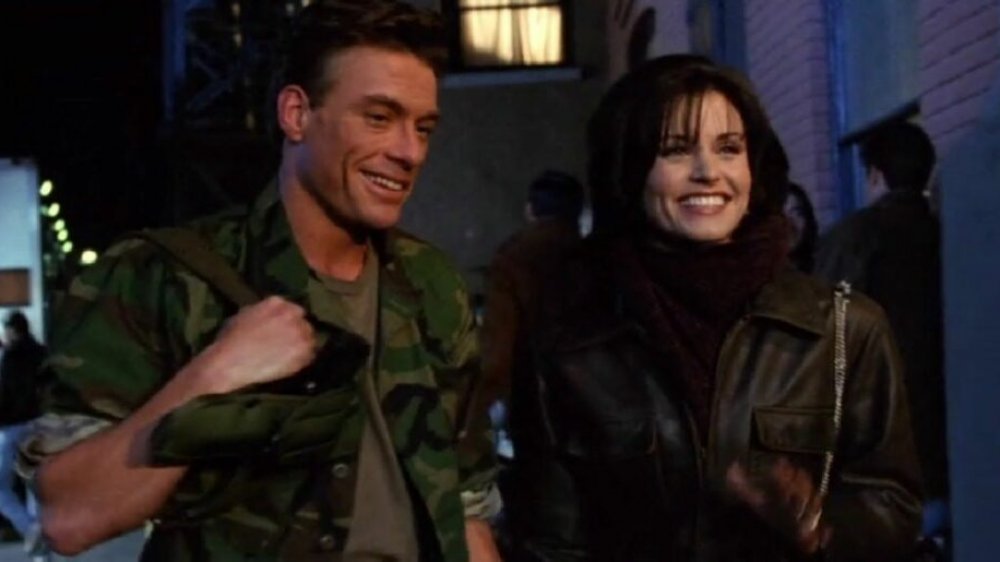 Jean-Claude Van Damme and Courteney Cox as Monica Geller in Friends