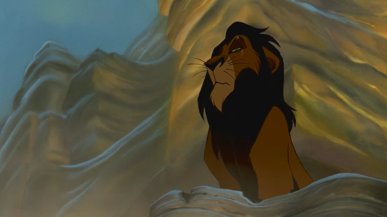 Scar looks down at Mufasa