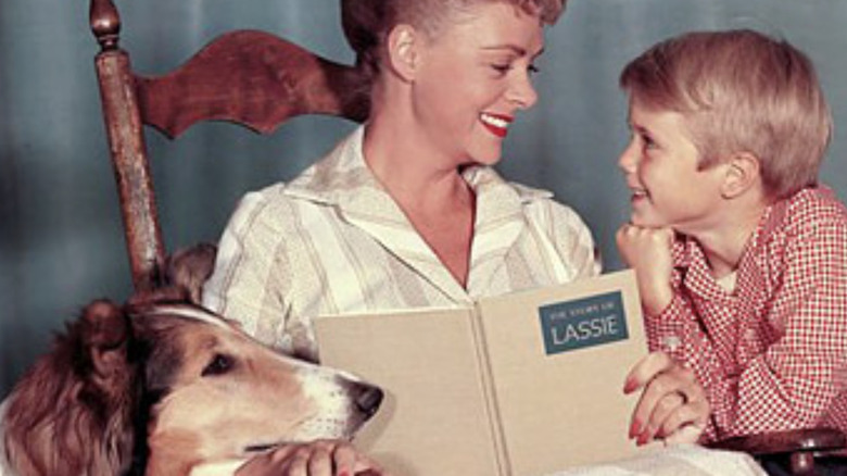 Mom reading to son and Lassie